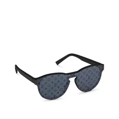 Sunglasses with a black frame and a single wraparound lens printed with a repeating gray-blue monogram pattern, on white.